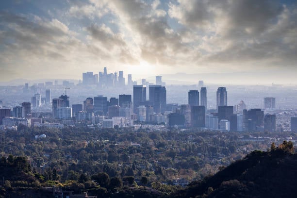 Century City with downtown Los Angeles skylines with cloudy sky.